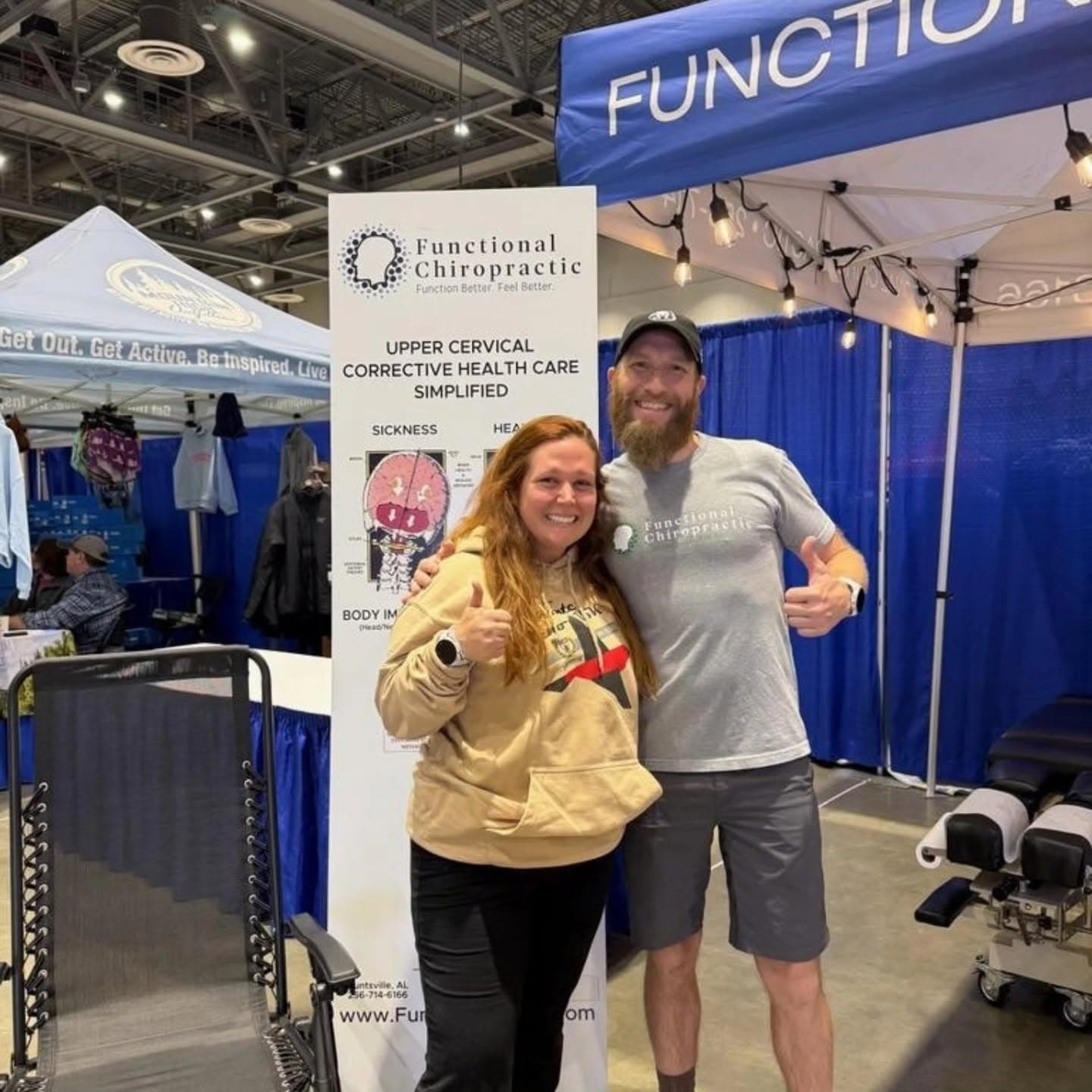 Dr. Porter with a patient at the Functional Chiropractic booth in Huntsville, AL