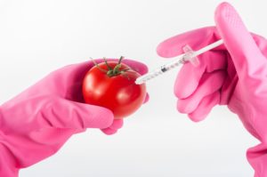 syringe and tomato depicting artificial immunity 